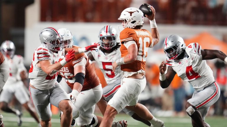 Texas Longhorns quarterback Arch Manning (16) looks to throw over Ohio State Buckeyes linebacker Payton Pierce (26) during the NCAA football game at Darrell K RoyalTexas Memorial Stadium in Austin, Texas on Sept. 12, 2026. Texas won 24-23.