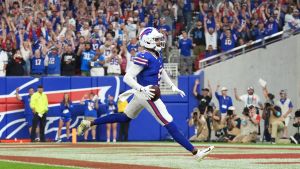 Sep 17, 2026; Orchard Park, New York, USA; Buffalo Bills wide receiver Joshua Palmer (5) runs to score a touchdown during the first half against the Detroit Lions at New Highmark Stadium. Mandatory Credit: Gregory Fisher-Imagn Images