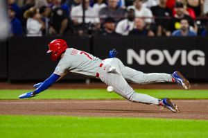 Sep 17, 2026; New York City, New York, USA; Philadelphia Phillies shortstop Trea Turner (7) dives safely into third base after advancing on an errant New York Mets pickoff throw to first base during the seventh inning at Citi Field. novig