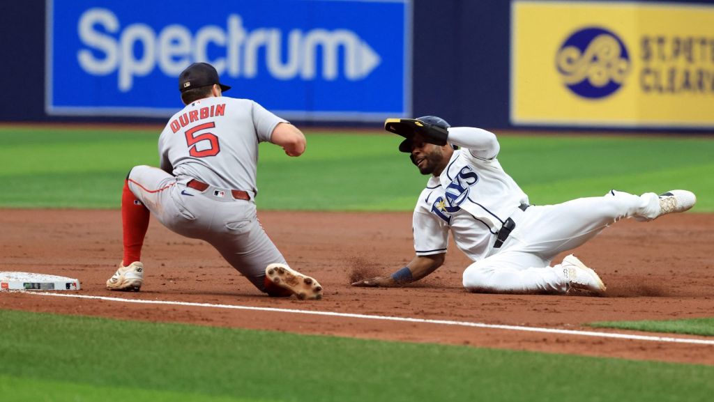 Sep 19, 2026; St. Petersburg, Florida, USA; Boston Red Sox third baseman Caleb Durbin (5) tags out Tampa Bay Rays center fielder Cedric Mullins (31) as he attempted to steal during the third inning at Tropicana Field. Mandatory Credit: Kim Klement Neitzel-Imagn Images