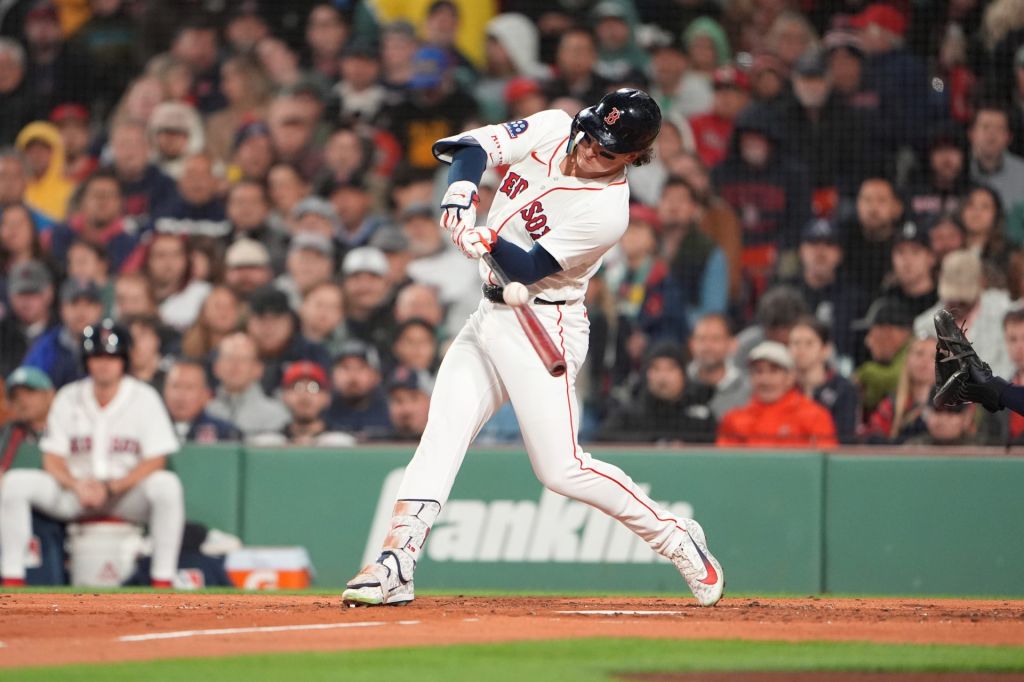 Sep 23, 2026; Boston, Massachusetts, USA; Boston Red Sox left fielder Roman Anthony (19) hits a single against the Cleveland Guardians during the third inning at Fenway Park.