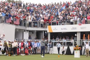 Sep 25, 2026; Medinah, Illinois, USA; Scottie Scheffler of the U.S. Team tees off on the first hole during the second round of the Presidents Cup.