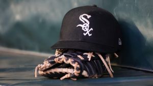 Jul 14, 2023; Atlanta, Georgia, USA; A detailed view of a Chicago White Sox hat and glove in the dugout against the Atlanta Braves in the fourth inning at Truist Park. Mandatory Credit: Brett Davis-USA TODAY Sports