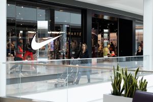 A shopper walks past a Nike store, as global markets brace for a hit to trade and growth caused by U.S. President Donald Trump's decision to impose import tariffs on dozens of countries, in the King of Prussia Mall in King of Prussia, Pennsylvania, U.S., April 3, 2025.