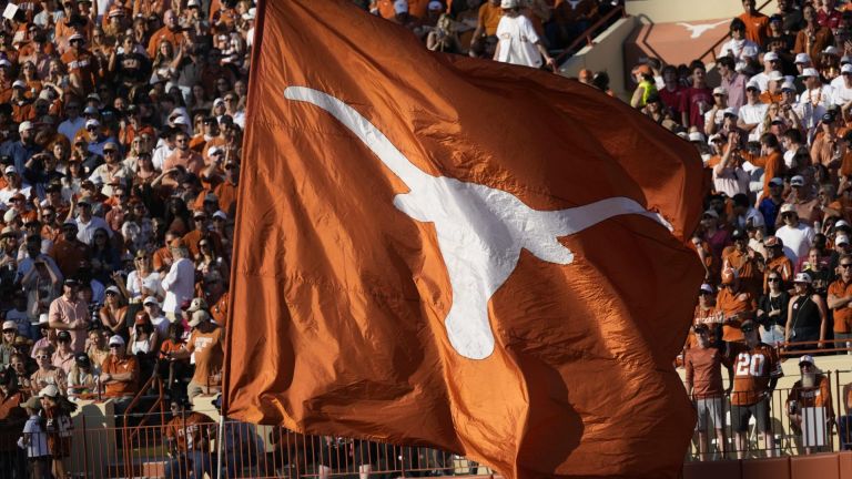 Nov 22, 2025; Austin, Texas, USA; Texas Longhorns flag on the field after a touchdown is scored during the first half against the Arkansas Razorbacks at Darrell K Royal-Texas Memorial Stadium. Mandatory Credit: Scott Wachter-Imagn Images