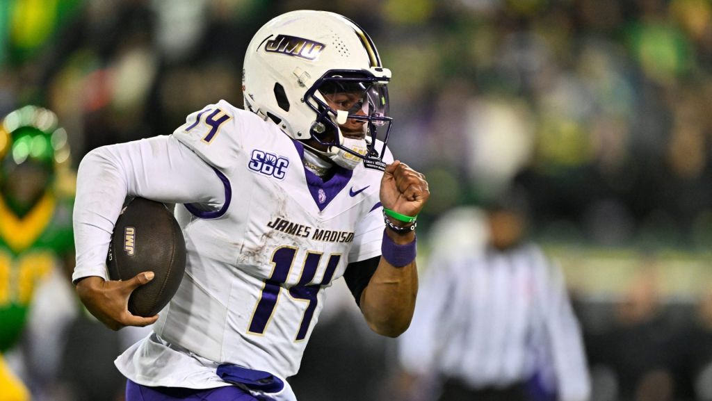 Dec 20, 2025; Eugene, OR, USA; James Madison Dukes quarterback Alonza Barnett III (14) rushes during the fourth quarter against the Oregon Ducks at Autzen Stadium