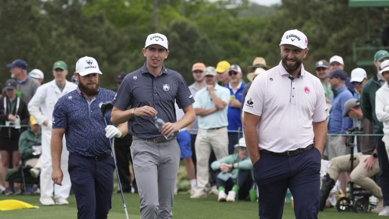 Apr 6, 2026; Augusta, Georgia, USA; Tyrrell Hatton, Tom McKibbin, and Jon Rahm walk down on the eighth hole during a practice round for the Masters Tournament at Augusta National Golf Club. Mandatory Credit: Michael Madrid-Imagn Images