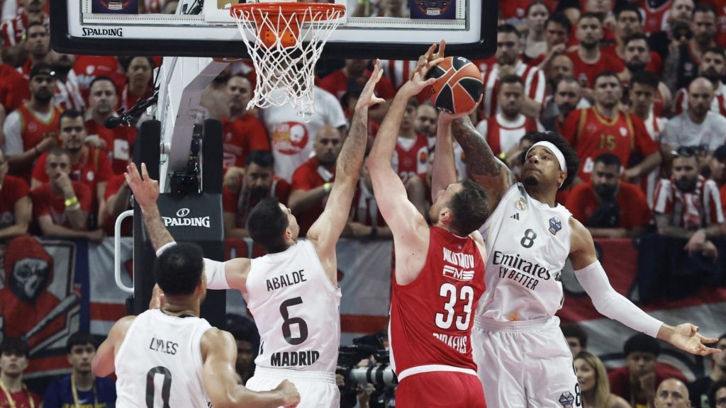 Basketball - Euroleague - Final - Olympiacos v Real Madrid - Telekom Center, Athens, Greece - May 24, 2026 Olympiacos' Nikola Milutinov in action with Real Madrid's Chuma Okeke and Alberto Abalde