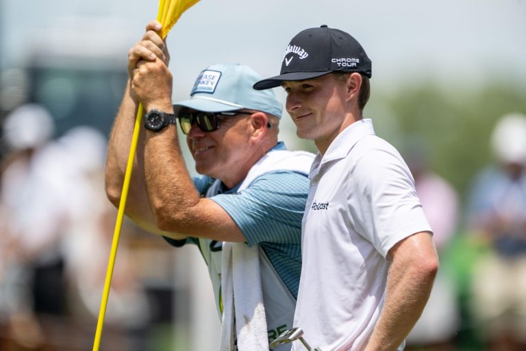 Jul 2, 2026; Silvis, Illinois, USA; Blades Brown smiles with his caddie, Brett Swedberg, on the 9th green during the first round of the John Deere Classic golf tournament.