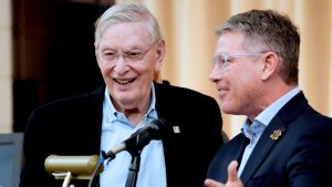 Former Major League Baseball Commissioner, Bud Selig, left, is introduced by Brewers broadcaster Brian Anderson at the Clinton Rose Senior Center on July 20, 2026, at a program to celebrate and honor the 755th home run of Hank Aaron from 1976. The event featured the viewing of a textile mural created by local artist, Rosy Petri.