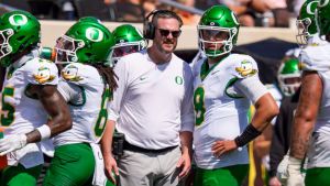 Oregon head coach Dan Lanning talks to Oregon quarterback Dylan Raiola on the sideline as the Oregon Ducks face the Oklahoma State Cowboys on Sept. 12, 2026, at Boone Pickens Stadium in Stillwater, Oklahoma.