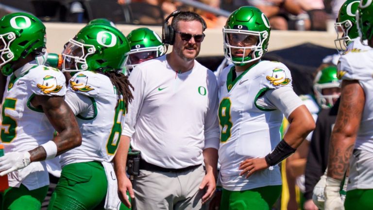 Oregon head coach Dan Lanning talks to Oregon quarterback Dylan Raiola on the sideline as the Oregon Ducks face the Oklahoma State Cowboys on Sept. 12, 2026, at Boone Pickens Stadium in Stillwater, Oklahoma.