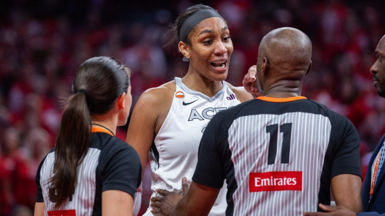 Sep 29, 2026; Indianapolis, Indiana, USA; Las Vegas Aces center A'ja Wilson (22) talks to a referee after she went into the stands to confront a fan during game two of the first round for the 2026 WNBA Playoffs against the Indiana Fever at Gainbridge Fieldhouse. Mandatory Credit: Trevor Ruszkowski-Imagn Images