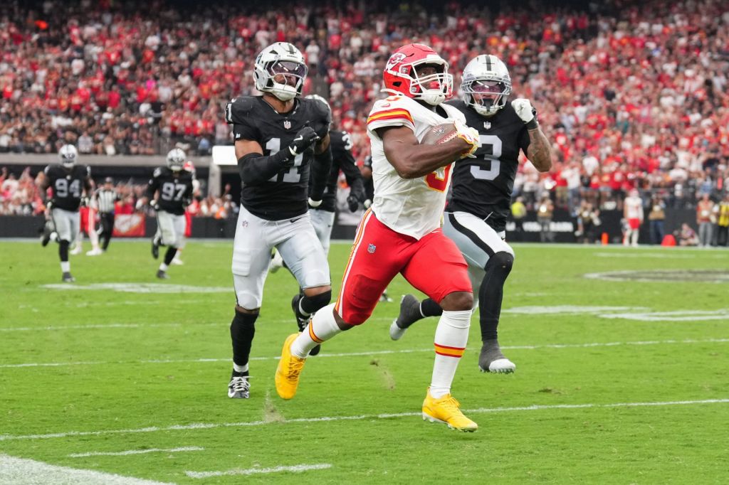 Oct 4, 2026; Paradise, Nevada, USA; Kansas City Chiefs running back Kenneth Walker III (9) runs for seventy-six yards against Las Vegas Raiders cornerback Taron Johnson (3) and safety Jeremy Chinn (11) during the fourth quarter at Allegiant Stadium.