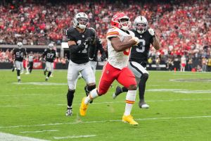 Oct 4, 2026; Paradise, Nevada, USA; Kansas City Chiefs running back Kenneth Walker III (9) runs for seventy-six yards against Las Vegas Raiders cornerback Taron Johnson (3) and safety Jeremy Chinn (11) during the fourth quarter at Allegiant Stadium.