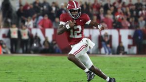 Oct 10, 2026; Tuscaloosa, Alabama, USA; Alabama Crimson Tide quarterback Keelon Russell (12) scrambles with the ball against the Georgia Bulldogs during the first quarter at Saban Field at Bryant-Denny Stadium. Mandatory Credit: David Leong-Imagn Images