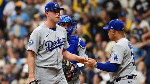 Oct 12, 2026; Milwaukee, Wisconsin, USA; Los Angeles Dodgers manager Dave Roberts relieves pitcher Kris Bubic (40) during the fifth inning against the Milwaukee Brewers in game two of the NLCS for the 2026 MLB Playoffs at American Family Field.
