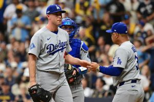 Oct 12, 2026; Milwaukee, Wisconsin, USA; Los Angeles Dodgers manager Dave Roberts relieves pitcher Kris Bubic (40) during the fifth inning against the Milwaukee Brewers in game two of the NLCS for the 2026 MLB Playoffs at American Family Field.