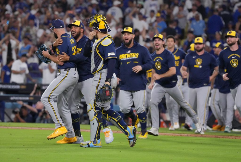 Oct 15, 2026; Los Angeles, California, USA; Milwaukee Brewers players celebrate after winning the NLCS for the 2026 MLB Playoffs against the Los Angeles Dodgers at Uniqlo Field at Dodger Stadium.