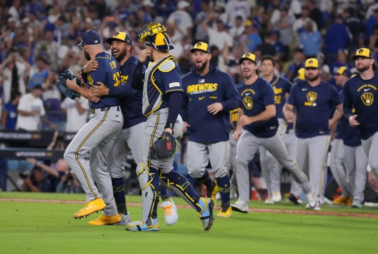 Oct 15, 2026; Los Angeles, California, USA; Milwaukee Brewers players celebrate after winning the NLCS for the 2026 MLB Playoffs against the Los Angeles Dodgers at Uniqlo Field at Dodger Stadium.