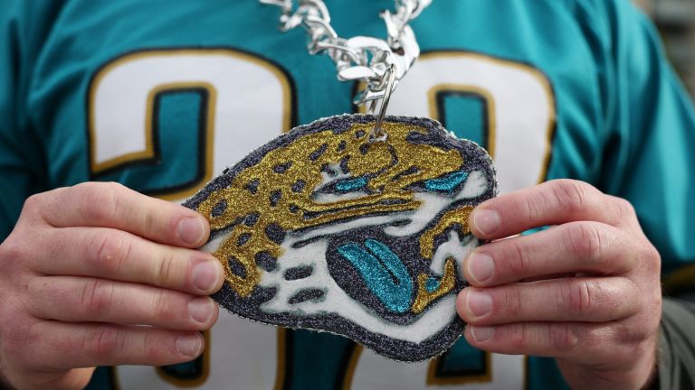 Football - NFL - Houston Texans v Jacksonville Jaguars - Wembley Stadium, London, Britain - October 18, 2026 The necklace of a Jacksonville Jaguars fan outside the stadium before the match