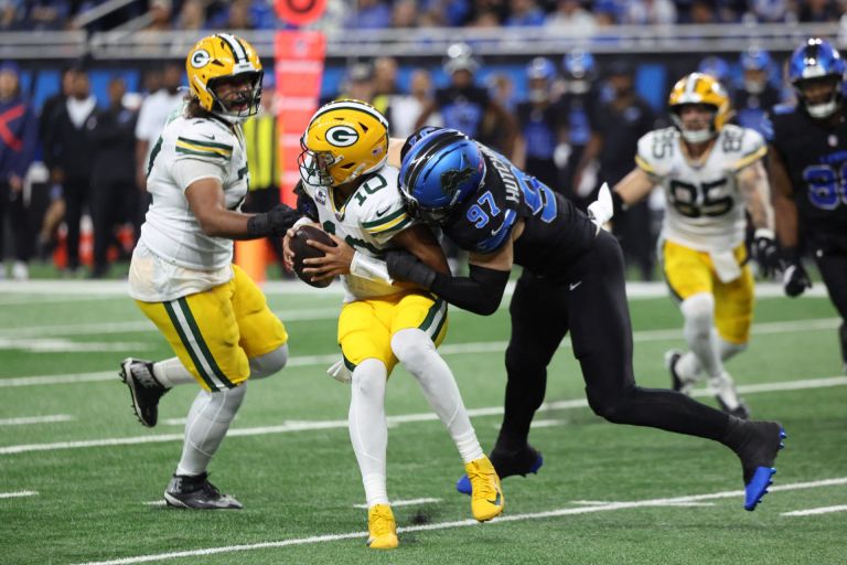 Oct 25, 2026; Detroit, Michigan, USA; Detroit Lions defensive end Aidan Hutchinson (97) sacks Green Bay Packers quarterback Jordan Love (10) during the second quarter at Ford Field.