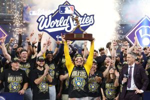 Oct 28, 2026; St. Petersburg, Florida, USA; Milwaukee Brewers catcher William Contreras (24) celebrates with the MVP trophy after defeating the Tampa Bay Rays in game five of the 2026 World Series at Tropicana Field.
