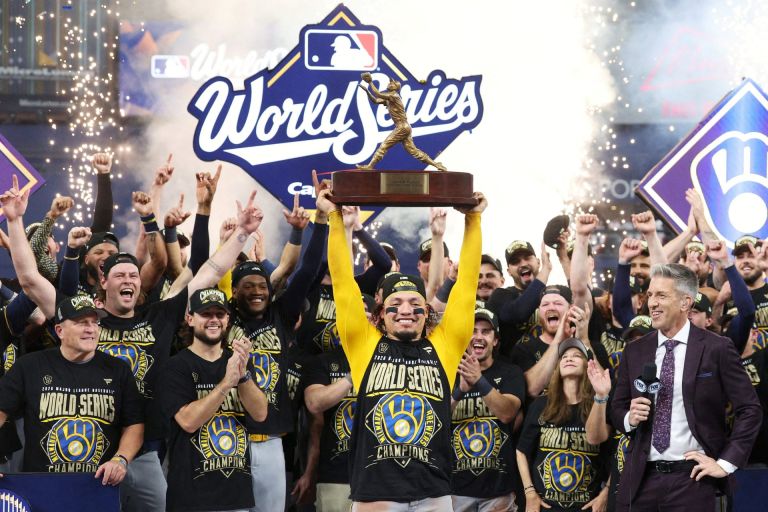 Oct 28, 2026; St. Petersburg, Florida, USA; Milwaukee Brewers catcher William Contreras (24) celebrates with the MVP trophy after defeating the Tampa Bay Rays in game five of the 2026 World Series at Tropicana Field.