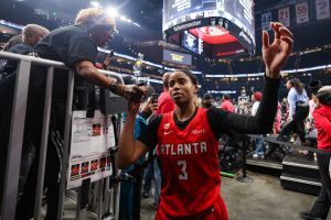Oct 29, 2026; Atlanta, Georgia, USA; Atlanta Dream guard Jordin Canada (3) celebrates with fans after a victory over the Golden State Valkyries in game six of the 2026 WNBA Finals at State Farm Arena.